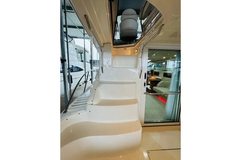 Slide: The Image of Staircase on a 1999 Sea Ray 400 Sedan Bridge yacht, leading to upper deck. - 23