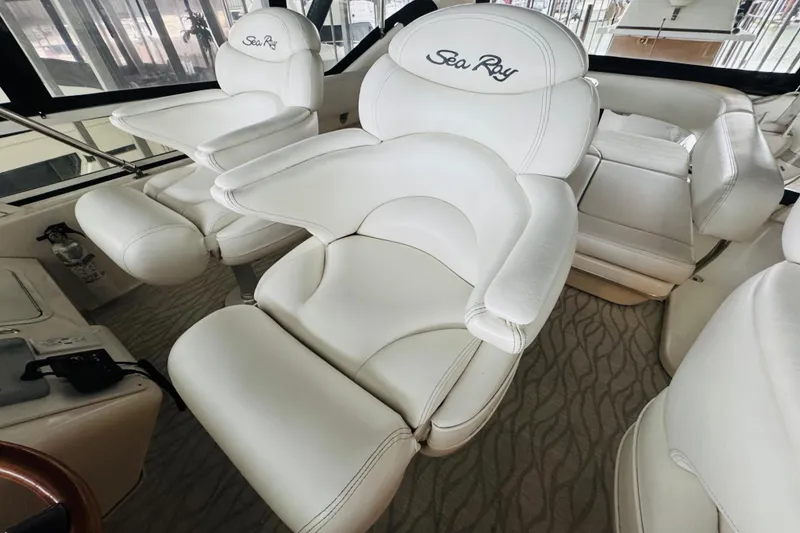 Slide: The Image of Luxurious white seating on a 1999 Sea Ray 400 Sedan Bridge yacht. - 32