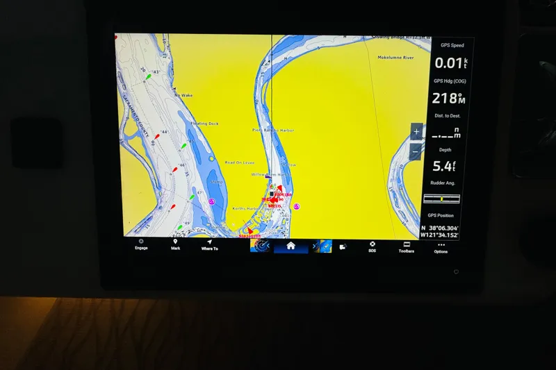 Slide: The Image of Navigation display on a 1999 Sea Ray 400 Sedan Bridge showing river map and GPS data. - 38