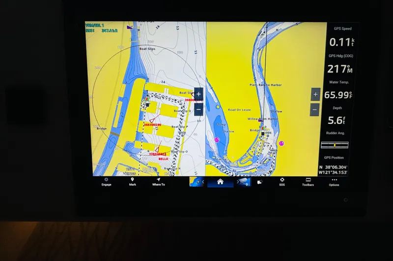 Slide: The Image of Navigation display on a 1999 Sea Ray 400 Sedan Bridge showing GPS data and map. - 39