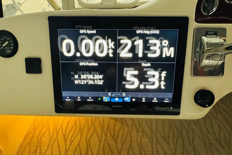 Slide: The Image of Garmin GPS display on 1999 Sea Ray 400 Sedan Bridge showing speed, heading, and depth. - 47
