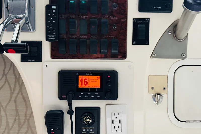 Slide: The Image of Control panel of a 1999 Sea Ray 400 Sedan Bridge with Garmin navigation system. - 52