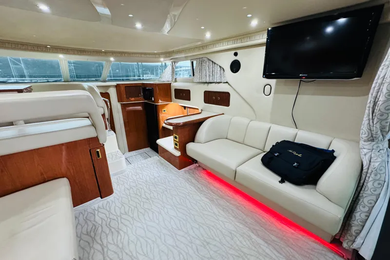 Slide: The Image of Luxurious interior of a 1999 Sea Ray 400 Sedan Bridge yacht with modern amenities. - 58