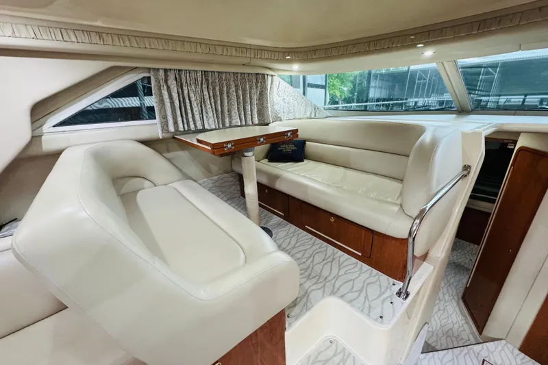 Slide: The Image of Luxurious interior of 1999 Sea Ray 400 Sedan Bridge with plush seating and elegant design. - 59