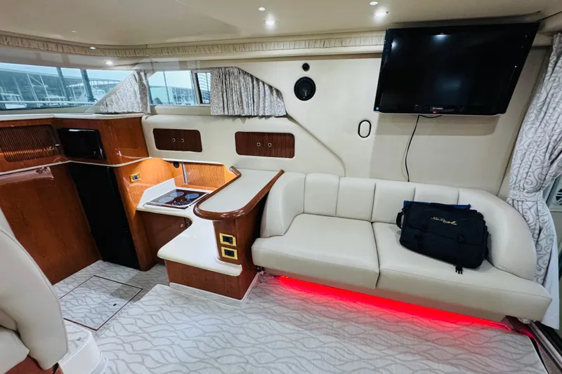 Slide: The Image of Luxurious interior of a 1999 Sea Ray 400 Sedan Bridge yacht with modern amenities. - 62