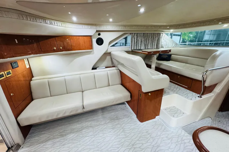 Slide: The Image of Luxurious interior of a 1999 Sea Ray 400 Sedan Bridge yacht with elegant seating. - 64
