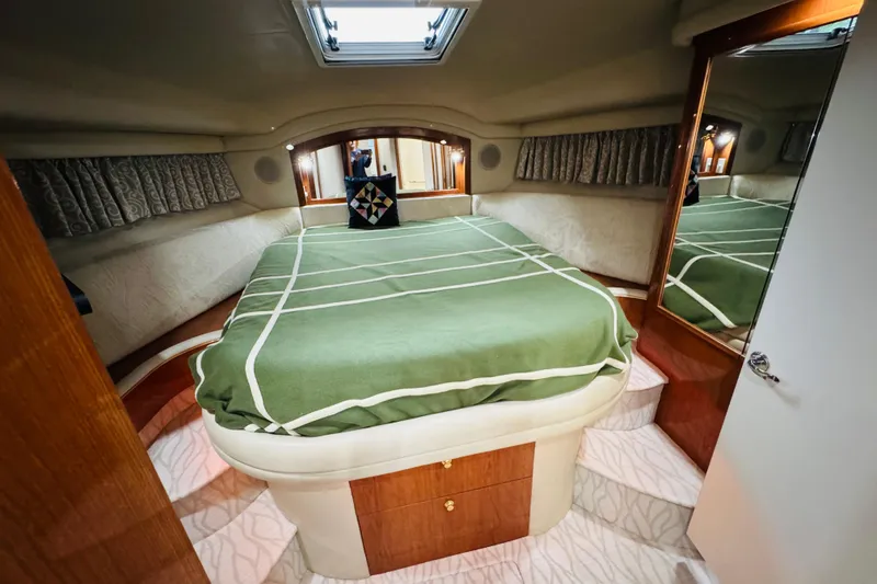 Slide: The Image of Luxurious bedroom interior of a 1999 Sea Ray 400 Sedan Bridge yacht. - 78