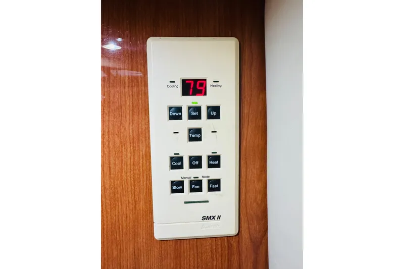 Slide: The Image of Thermostat control panel on 1999 Sea Ray 400 Sedan Bridge yacht interior. - 90