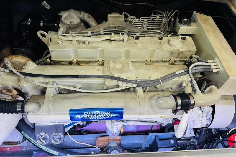 Slide: The Image of Engine of a 1999 Sea Ray 400 Sedan Bridge boat, featuring Diamond Performance Series components. - 93