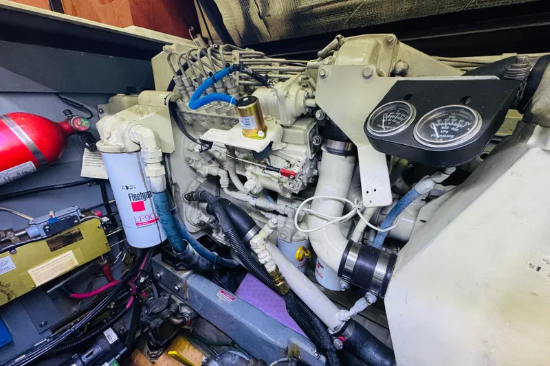 Slide: The Image of Engine compartment of a 1999 Sea Ray 400 Sedan Bridge with visible gauges and components. - 96