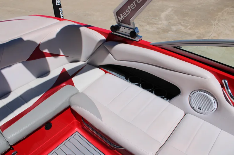 Slide: The Image of Interior of 2007 MasterCraft X2 boat with red and white seating and speaker. - 10