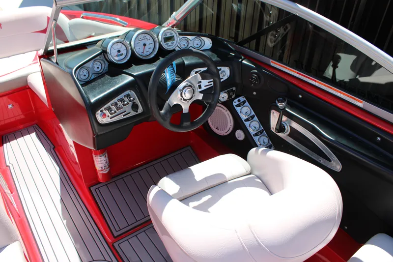 Slide: The Image of 2007 MasterCraft X2 boat interior with steering wheel and dashboard controls. - 13