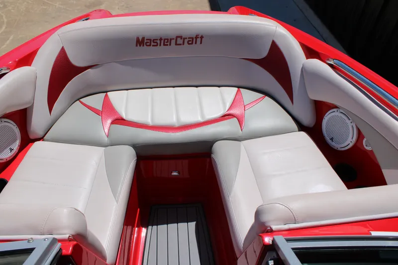 Slide: The Image of 2007 MasterCraft X2 boat interior with red and white seating and speakers. - 14