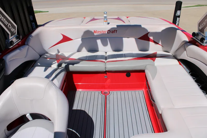 Slide: The Image of 2007 MasterCraft X2 boat interior with red and white seating and sleek design. - 15