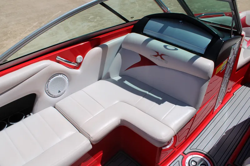 Slide: The Image of 2007 MasterCraft X2 boat interior with red and white seating and speaker detail. - 9