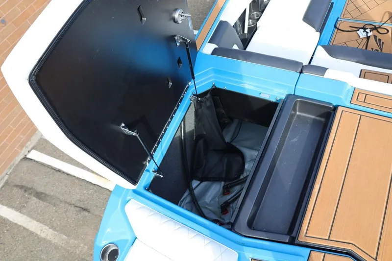 Slide: The Image of 2022 Tigé Z3 boat storage compartment with open hatch, showcasing interior space. - 18