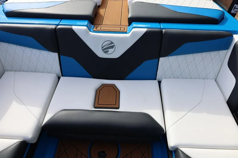 Slide: The Image of 2022 Tigé Z3 boat interior with blue, white, and black seating design. - 27