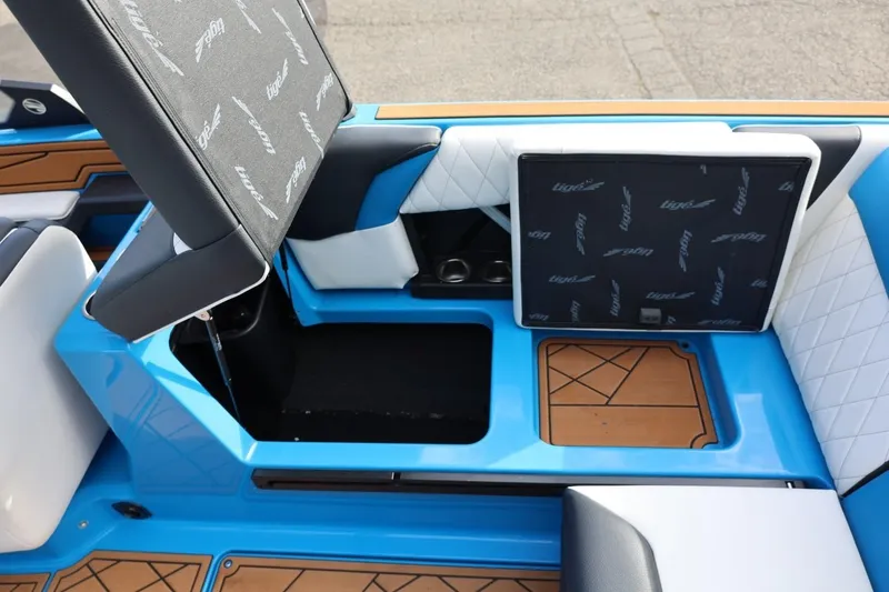 Slide: The Image of 2022 Tigé Z3 boat interior with blue accents and storage compartments. - 30