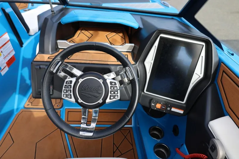 Slide: The Image of 2022 Tigé Z3 boat dashboard with steering wheel and touchscreen display. - 37