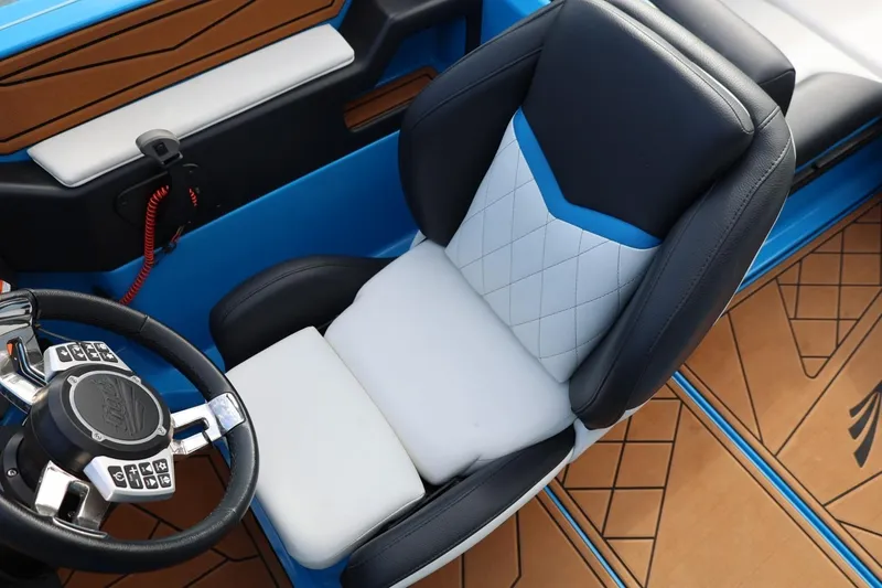 Slide: The Image of 2022 Tigé Z3 boat interior with luxurious seating and modern steering wheel design. - 39