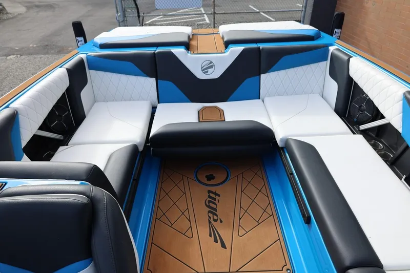 Slide: The Image of 2022 Tigé Z3 boat interior with blue and white seating, stylish design. - 40