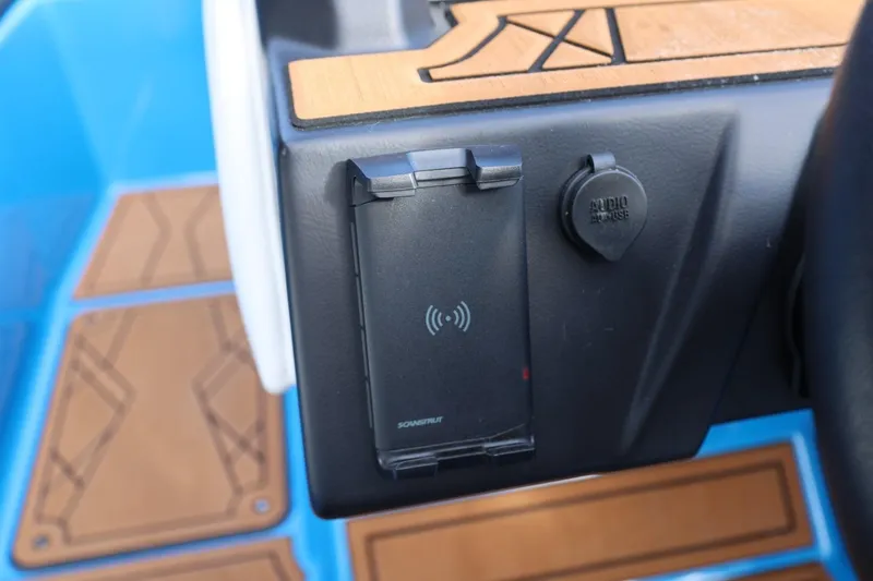 Slide: The Image of 2022 Tigé Z3 boat dashboard with wireless charging pad and audio input. - 43