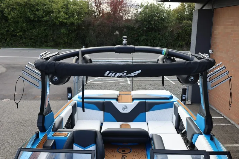 Slide: The Image of 2022 Tigé Z3 boat interior with blue and white seating, featuring a sleek design. - 51