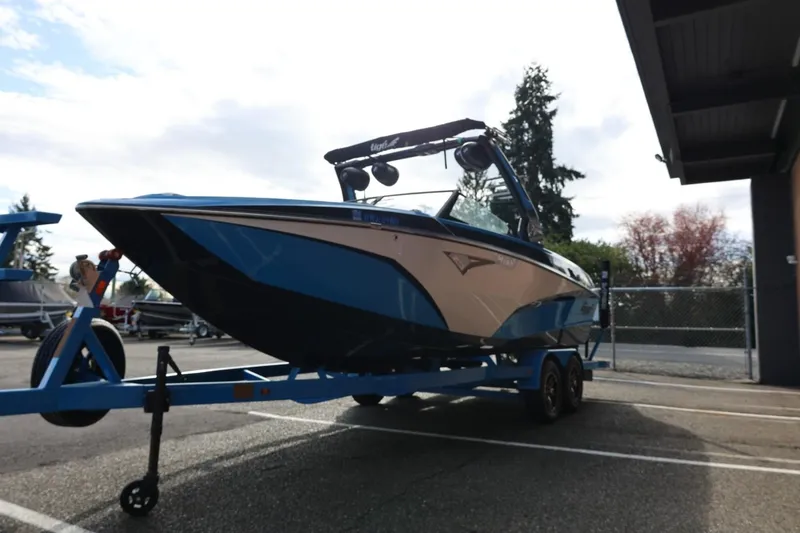 Slide: The Image of 2022 Tigé Z3 boat on trailer in parking lot, side view. - 8