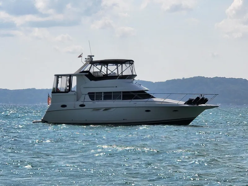 Slide: The Image of 2000 Silverton 422 Motor Yacht on open water. - 1