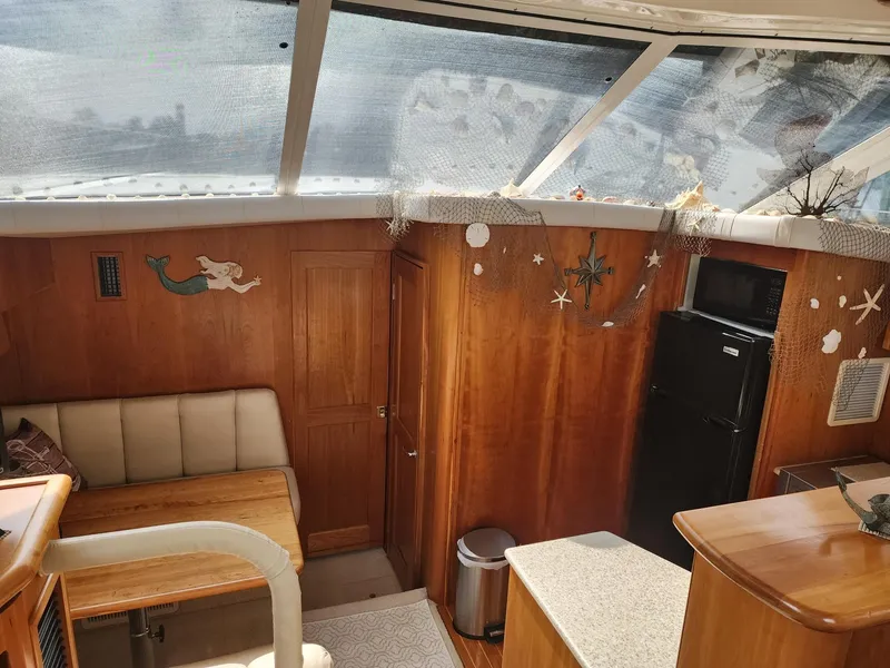 Slide: The Image of Interior of 2000 Silverton 422 Motor Yacht with wood finish. - 12