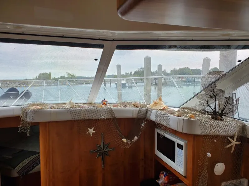 Slide: The Image of Interior of a Silverton 422 Motor Yacht, decorated with nautical elements. - 16