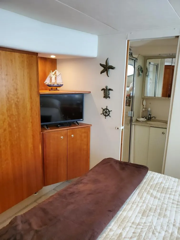 Slide: The Image of Interior of 2000 Silverton 422 Motor Yacht with wooden furnishings and decor. - 19