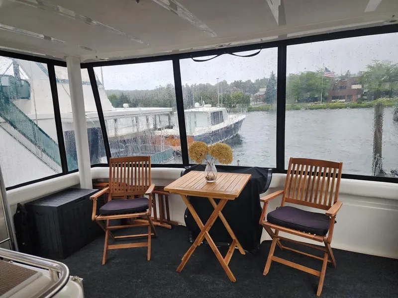 Slide: The Image of Interior of 2000 Silverton 422 Motor Yacht with table and chairs. - 2