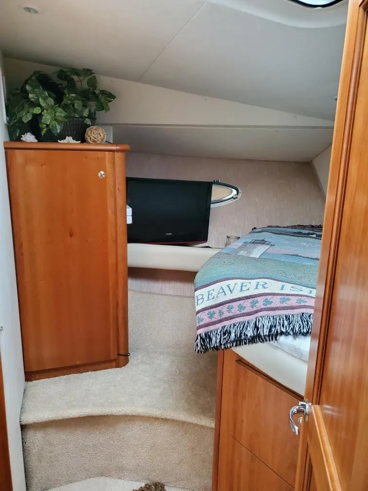 Slide: The Image of Interior of 2000 Silverton 422 Motor Yacht featuring cozy bedroom. - 21