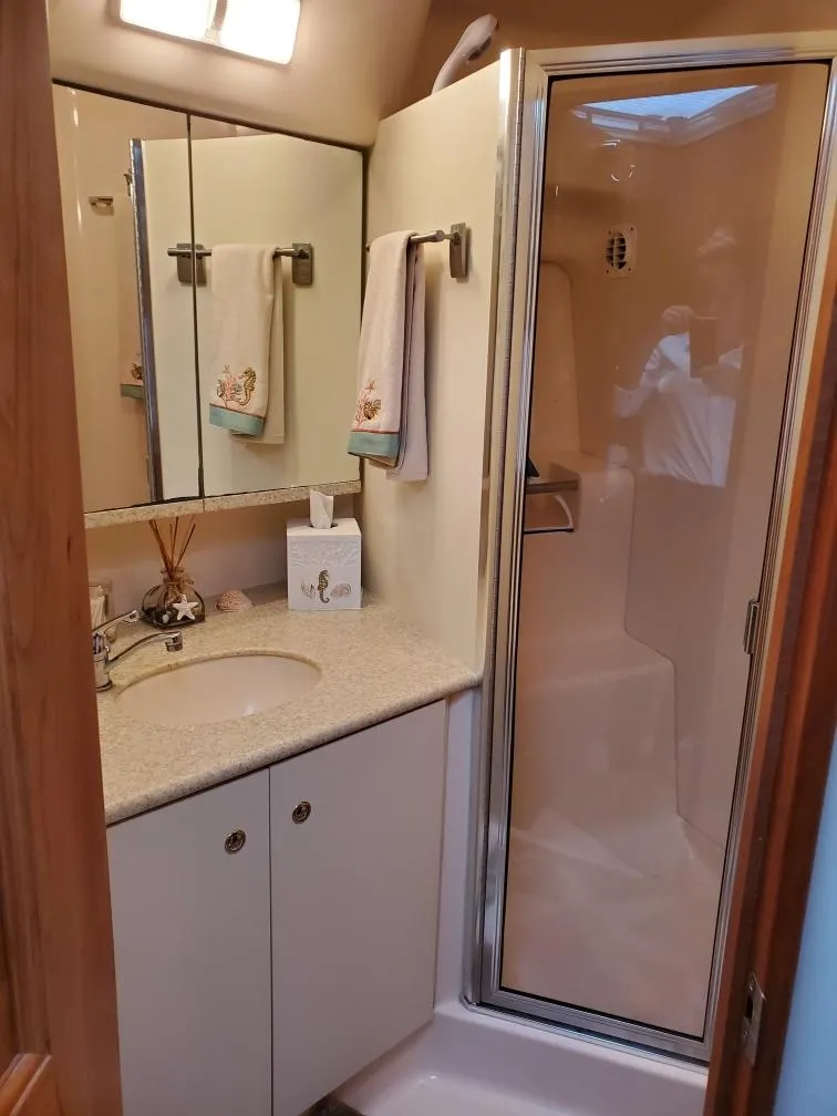 Slide: The Image of 2000 Silverton 422 Motor Yacht bathroom with shower and mirror. - 23