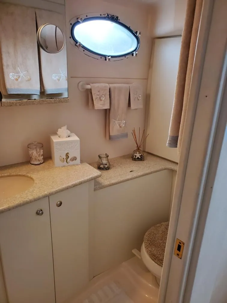 Slide: The Image of 2000 Silverton 422 Motor Yacht bathroom with elegant decor. - 25