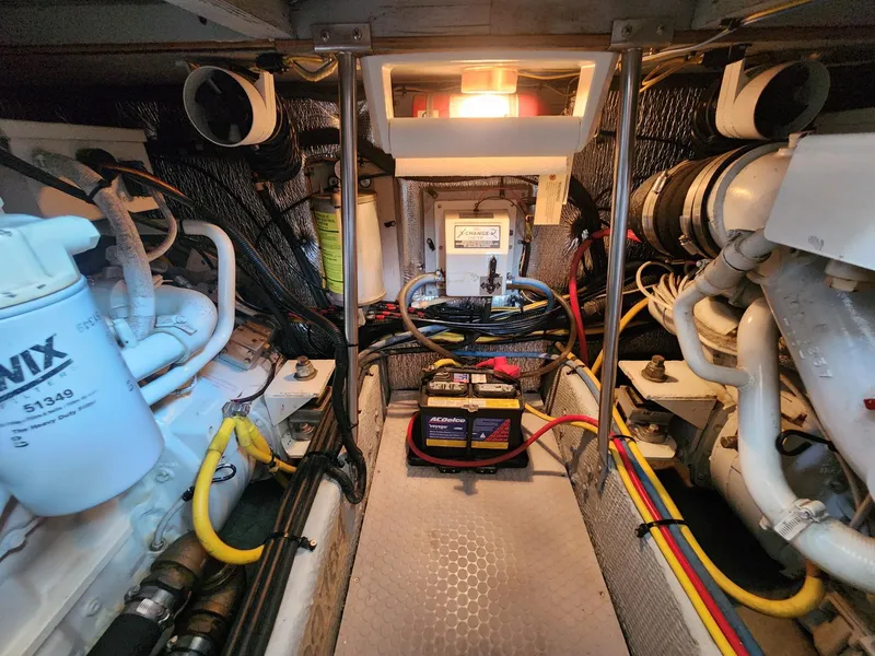 Slide: The Image of Engine room of 2000 Silverton 422 Motor Yacht with cables and battery. - 29