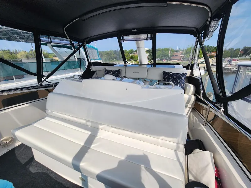 Slide: The Image of Interior of 2000 Silverton 422 Motor Yacht with white seating. - 3