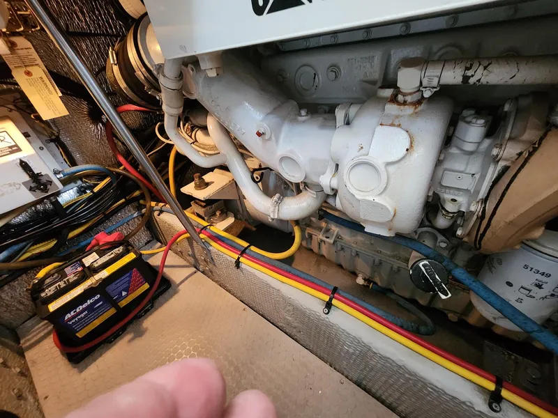 Slide: The Image of Engine room of 2000 Silverton 422 Motor Yacht with cables and battery. - 32