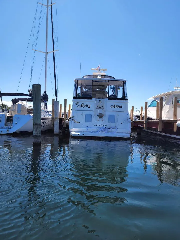 Slide: The Image of 2000 Silverton 422 Motor Yacht docked in marina. - 36