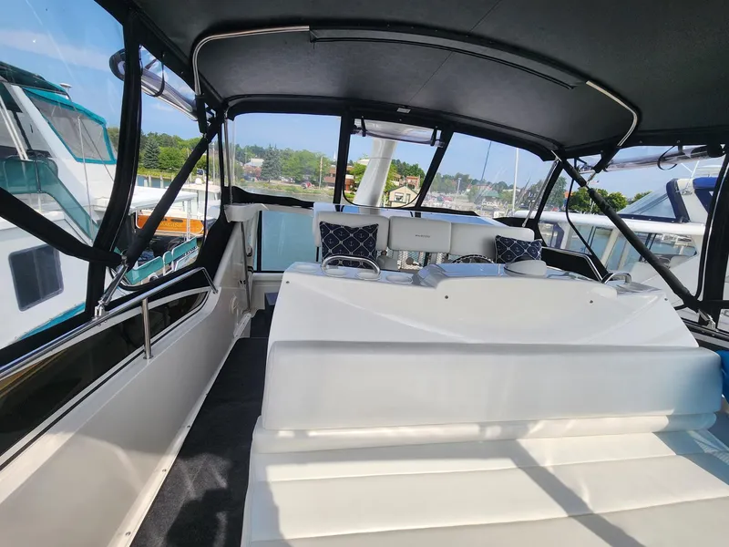 Slide: The Image of Interior of 2000 Silverton 422 Motor Yacht docked at marina. - 4