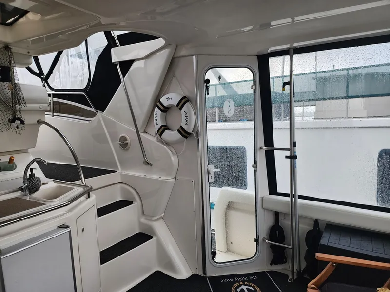 Slide: The Image of Interior of 2000 Silverton 422 Motor Yacht with stairs and door. - 7