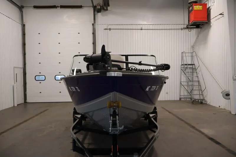 Slide: The Image of 2015 Starcraft Super Fisherman 186 boat in a spacious indoor garage. - 2