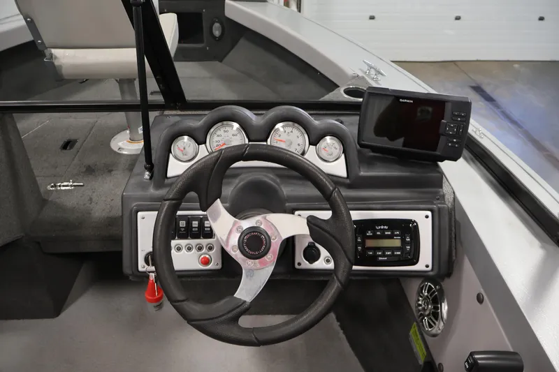 Slide: The Image of 2015 Starcraft Super Fisherman 186 dashboard with steering wheel and navigation system. - 20