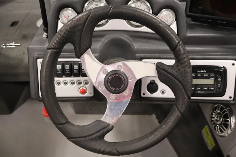Slide: The Image of Steering wheel of 2015 Starcraft Super Fisherman 186 boat with dashboard controls. - 21