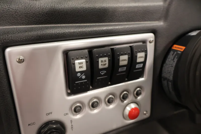 Slide: The Image of Control panel of a 2015 Starcraft Super Fisherman 186 boat with labeled switches. - 24
