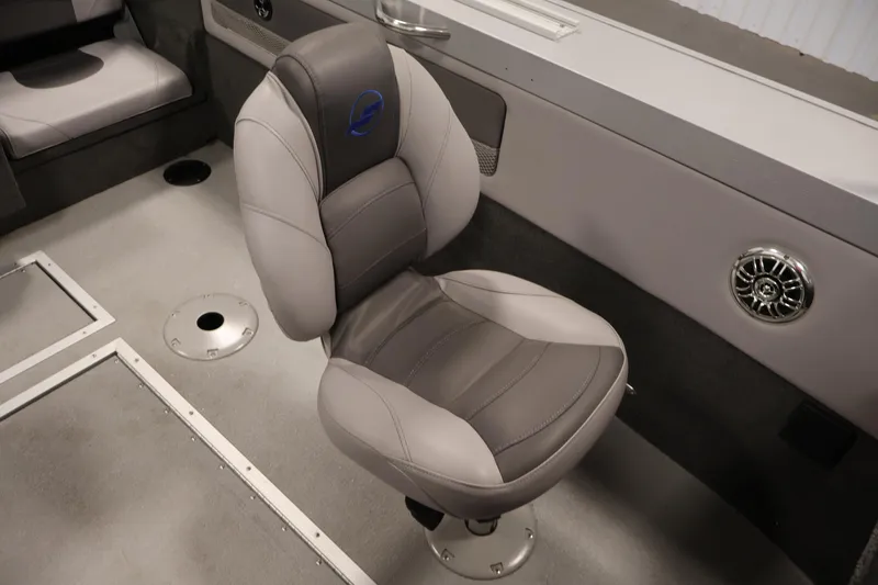 Slide: The Image of 2015 Starcraft Super Fisherman 186 boat interior with gray swivel seat and speaker. - 30