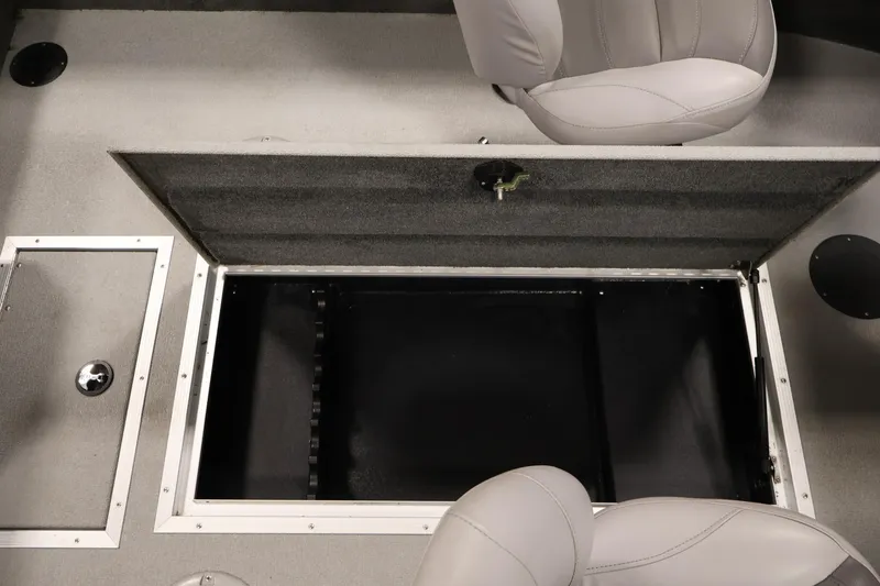 Slide: The Image of 2015 Starcraft Super Fisherman 186 interior with open storage compartment and seating. - 31