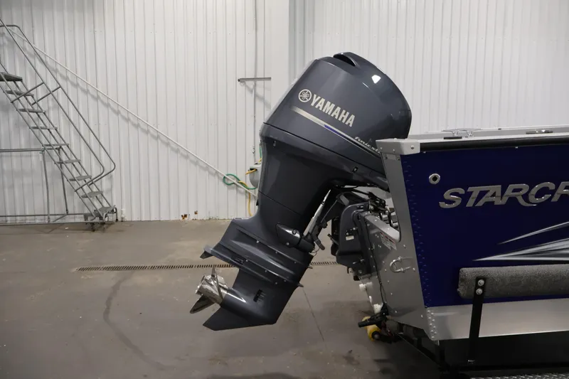 Slide: The Image of 2015 Starcraft Super Fisherman 186 with Yamaha outboard motor in a garage setting. - 42