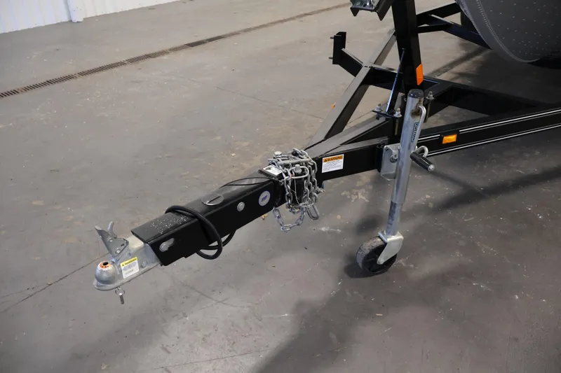 Slide: The Image of Trailer hitch of a 2015 Starcraft Super Fisherman 186 boat, featuring safety chains and jack wheel. - 45